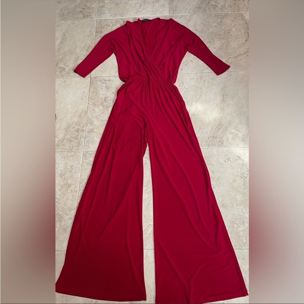 Wide leg elastic waist cross over red jumpsuit. Size small. *Belt NOT included*